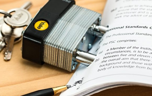 Padlock Going Through a Document