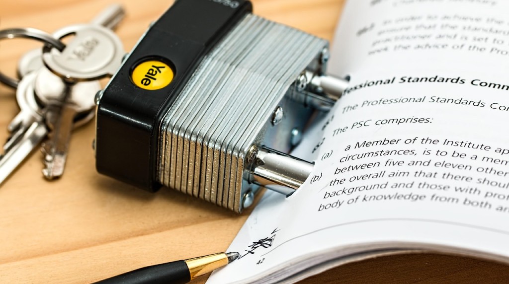Padlock Going Through a Document