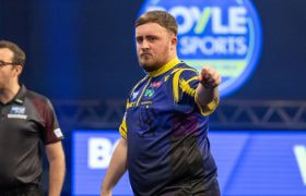 Luke Littler in Action at Darts' 2025 World Grand Prix.