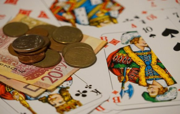 Playing cards, coins and bank notes