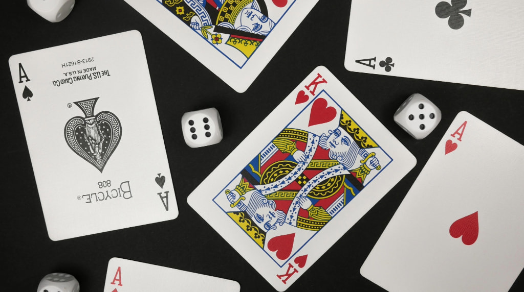 An Assortment of Dice and Playing Cards