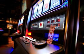 A Slot Machine with ‘Out of Order’ Tape Over Its Cash Slot.