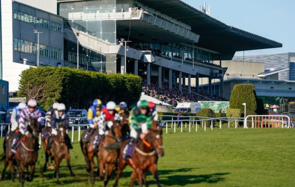 Horses thunder around Leopardstown watched by a huge crowd in the grandstand.