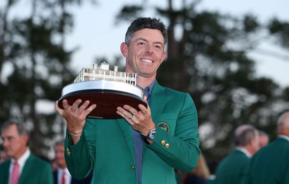Rory McIlroy Poses with the Masters Trophy During the Green Jacket Ceremony