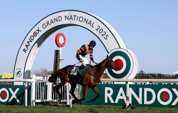 Patrick Mullins celebrates 2025 Grand National success aboard Nick Rockett.