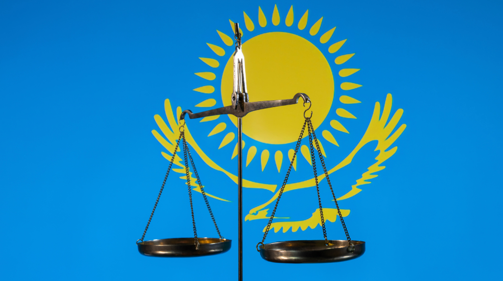 The Scales of Justice Against the Background of the Flag of Kazakhstan.