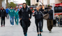 George Russell Walks into Bahrain International Circuit's Paddock, Followed by a Netflix Crew.