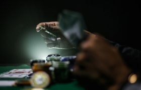 Casino Player Holding Gambling Chips