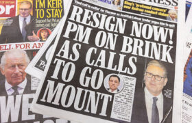 A Daily Express newspaper cover shows Sir Keir Starmer with a headline stating there is calls for his resignation.