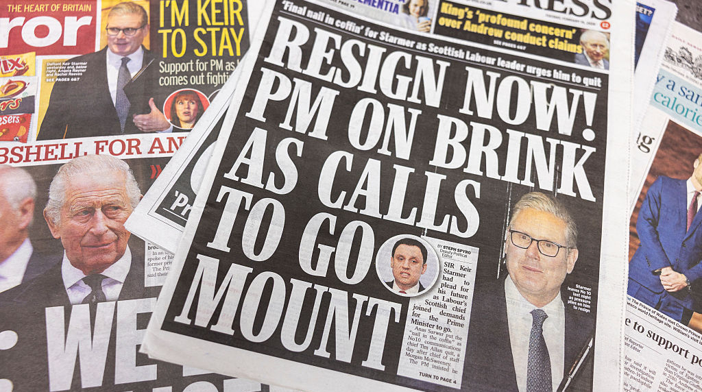 A Daily Express newspaper cover shows Sir Keir Starmer with a headline stating there is calls for his resignation.