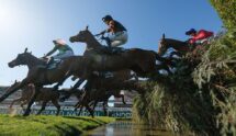 Patrick Mullins Riding Nick Rockett Clears the Water Jump on Their Way to Winning the 2025 Grand National.