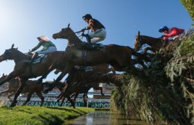 Patrick Mullins Riding Nick Rockett Clears the Water Jump on Their Way to Winning the 2025 Grand National.