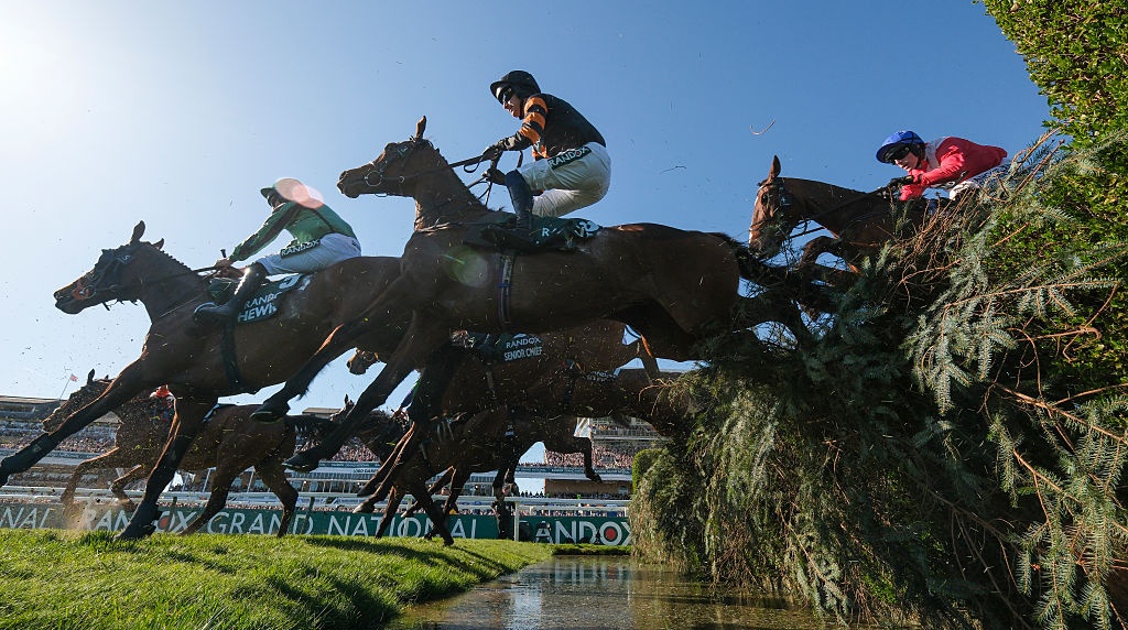Patrick Mullins Riding Nick Rockett Clears the Water Jump on Their Way to Winning the 2025 Grand National.