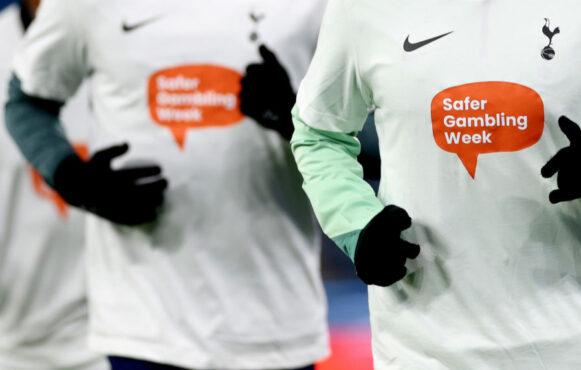 Tottenham Hotspur players seen wearing Safer Gambling Week warm up tops before a 2024 Premier League match.