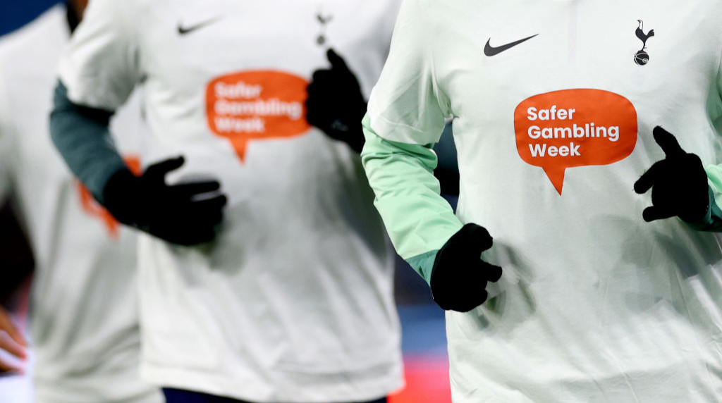 Tottenham Hotspur players seen wearing Safer Gambling Week warm up tops before a 2024 Premier League match.