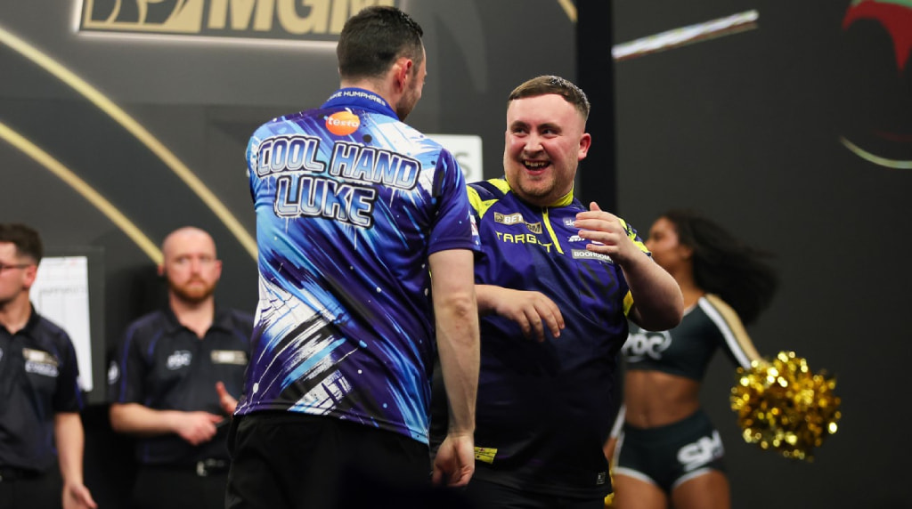 Luke littler at the oche.