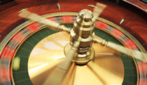 A Roulette Wheel in a Casino Spinning Around