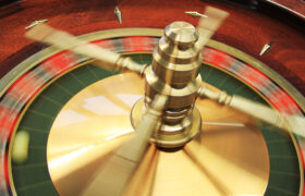 A Roulette Wheel in a Casino Spinning Around
