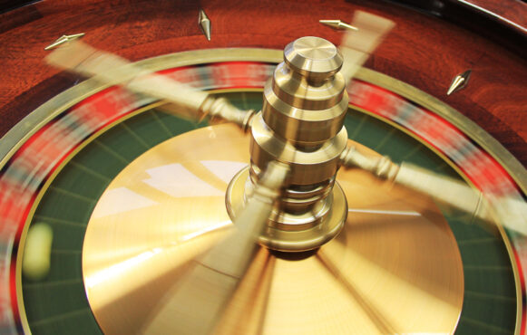 A Roulette Wheel in a Casino Spinning Around
