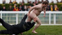 A Groundsman Attempts to Tackle a Streaker During 2016s Gold Cup Day at the Cheltenham Festival.