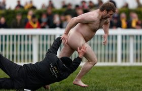 A Groundsman Attempts to Tackle a Streaker During 2016s Gold Cup Day at the Cheltenham Festival.