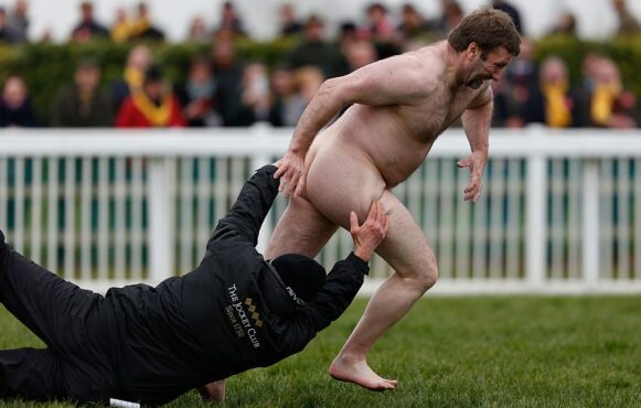 A Groundsman Attempts to Tackle a Streaker During 2016s Gold Cup Day at the Cheltenham Festival.