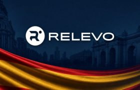 The Logo of Relevo on a Dark Background with Red and Yellow Stripes