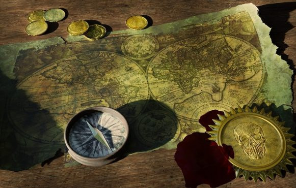 Treasure map with compass, gold coins and ancient artifact