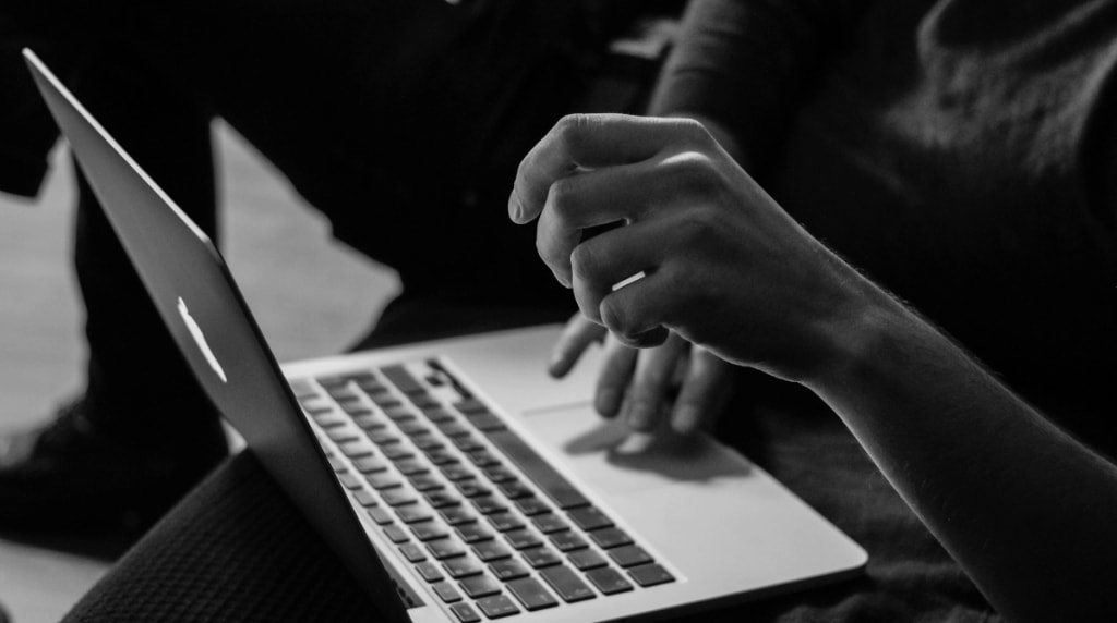 Open laptop with user