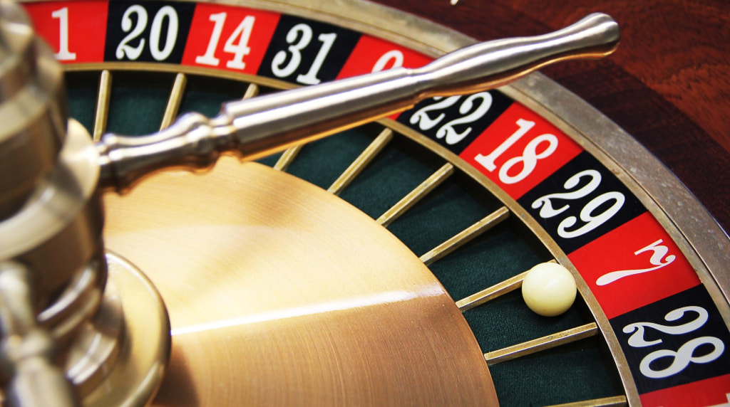 Roulette wheel with ball landing on seven